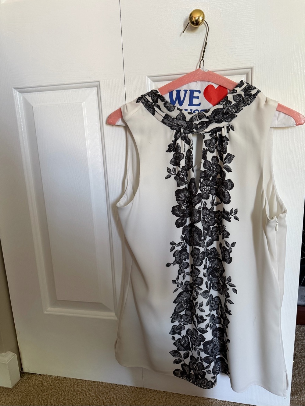 Sleeveless White Dress with Black Floral Trim